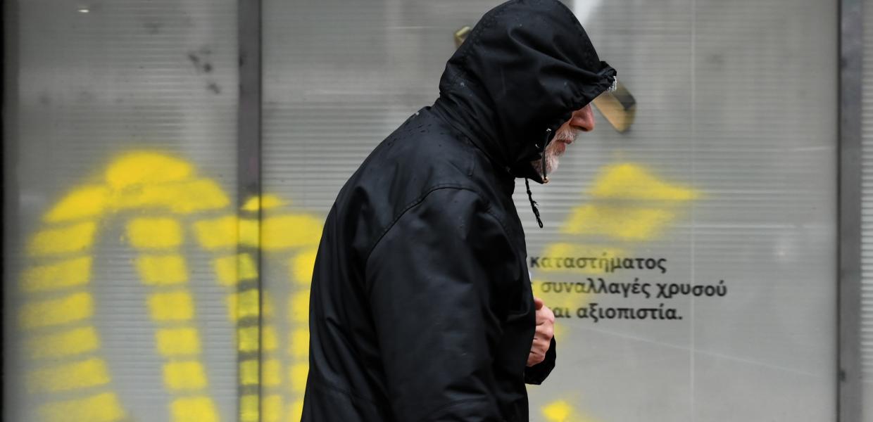 κρύο κακοκαιρία άνδρας μπουφάν