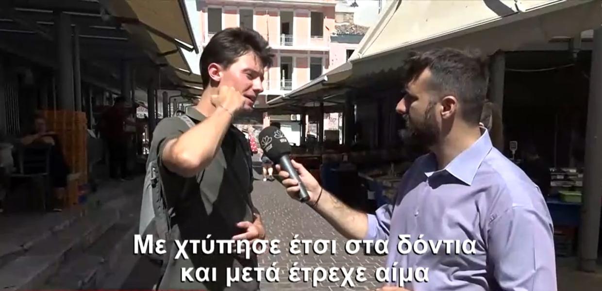 Άνδρας κάνει δηλώσεις σε δημοσιογράφο